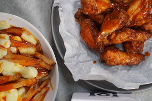 Magical Buffalo Wings with a side Of Magical Poutine
