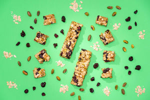 Pistachio Cranberry Granola Bars On Green Background